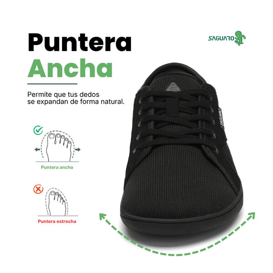 Zapatilla barefoot urbana frontal negra, suela delgada zero drop.